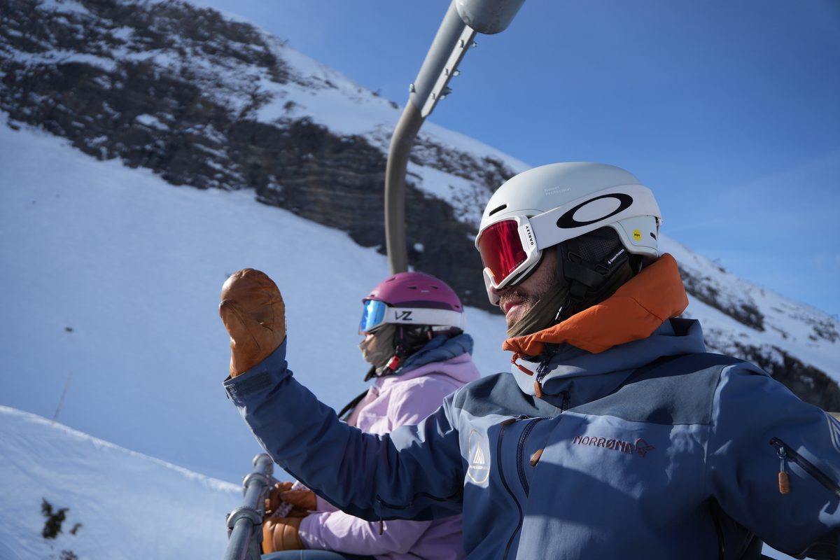 Ski instructor course students riding the chairlift on a bluebird day